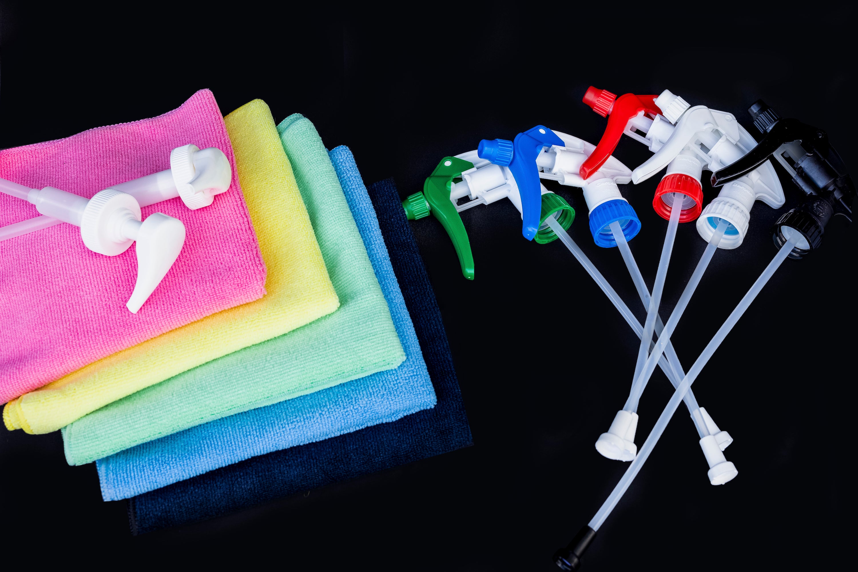 Cleaning Supplies. Spray triggers green blue red white black. microfibre cloths pink yellow green blue black. Pump dispensers